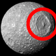 Illustration for article titled Does Saturn's 'Death Star' Moon Harbor A Hidden Ocean?